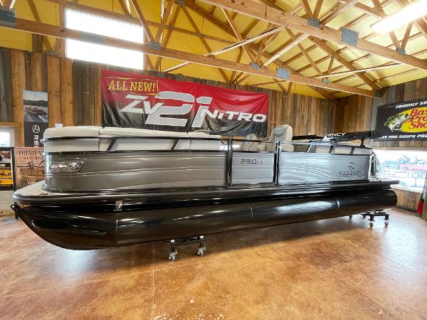 Regency 230 LE3 2023 Regency 230 LE3 pontoon boat displayed indoors.