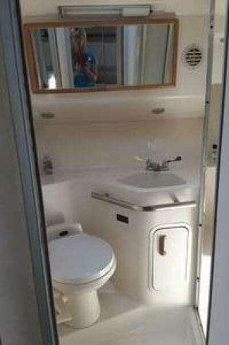 Sea Ray 400 Sundancer Bathroom interior of 1993 Sea Ray 400 Sundancer yacht, featuring sink and toilet.