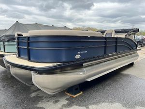 Harris Cruiser 230 2025 Harris Cruiser 230 pontoon boat with sleek design, docked under cloudy skies.