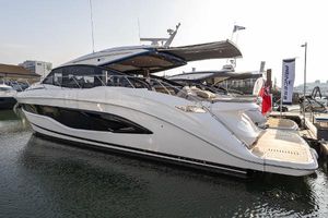 Princess V55 2024 Princess V55 yacht docked at marina, showcasing sleek design and luxury features.