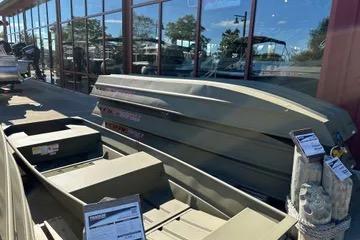 Tracker Grizzly 10 Jon 2026 Tracker Grizzly 10 Jon boats displayed outside a showroom.