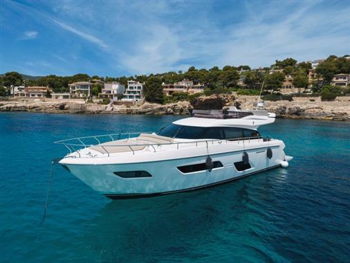 Ferretti Yachts 550 2017 Ferretti Yachts 550 in clear blue waters near coastal homes.