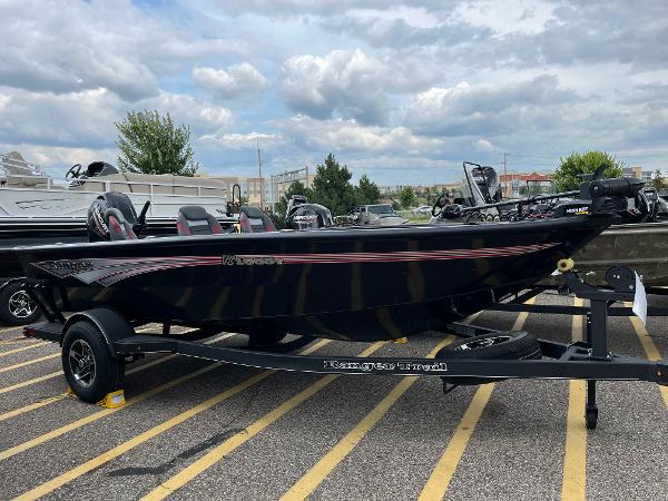 Ranger VS1665T 2024 Ranger VS1665T boat on trailer in parking lot.