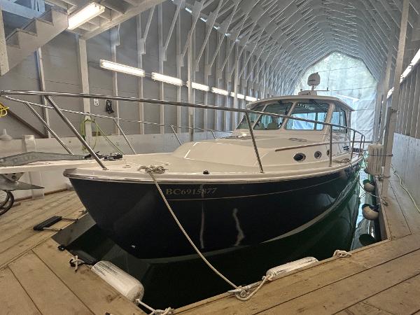 Back Cove 34 2015 Back Cove 34 boat docked in covered marina.