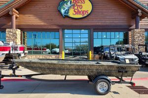Tracker Grizzly 1754 Utility 2026 Tracker Grizzly 1754 Utility boat on trailer outside Bass Pro Shops.