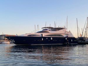 Astondoa 95 Luxury Astondoa 95 yacht from 1999 docked at sunset in a marina.