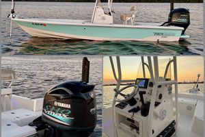 Pathfinder 2200 TRS 2014 Pathfinder 2200 TRS boat on water, featuring Yamaha engine and modern cockpit controls.