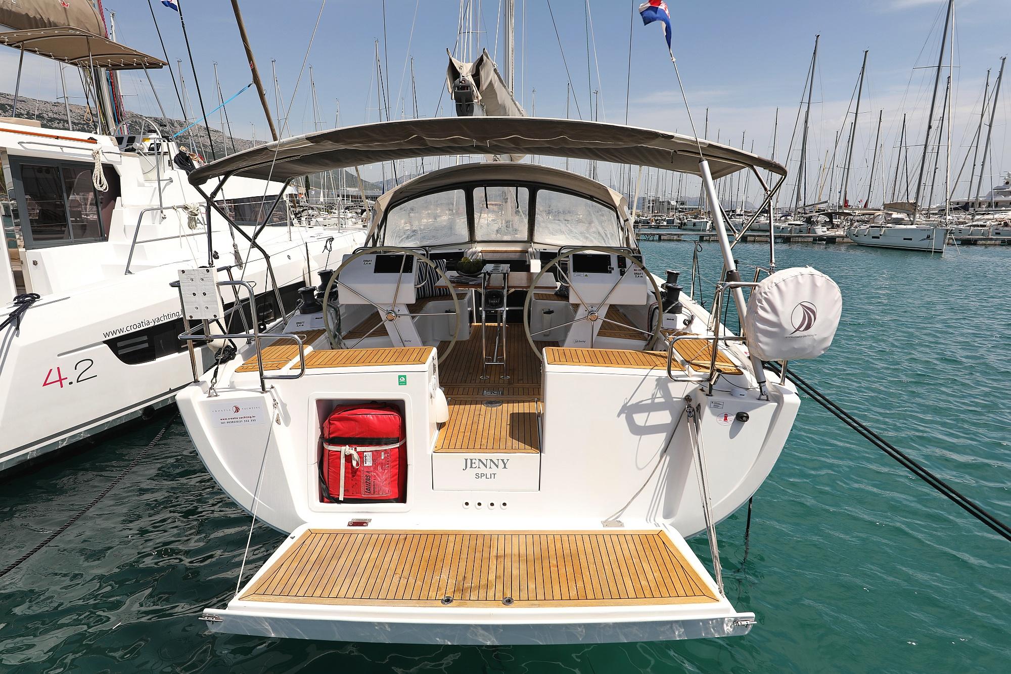 Hanse 455 Hanse 455 yacht, 2017 model, docked in marina with clear blue water.