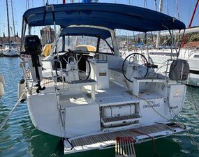 Beneteau Oceanis 38.1 2019 Beneteau Oceanis 38.1 sailboat docked in marina, featuring dual steering wheels.