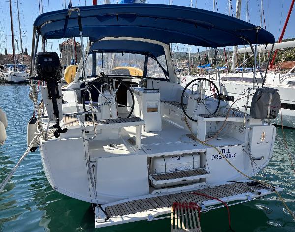 Beneteau Oceanis 38.1 2019 Beneteau Oceanis 38.1 sailboat docked in marina, featuring dual steering wheels.
