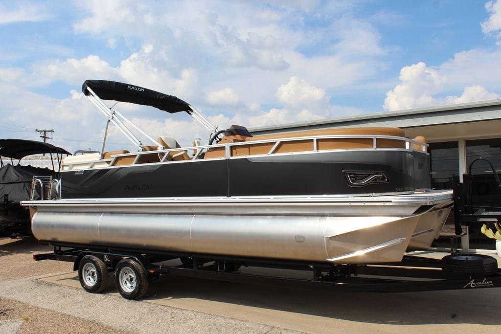 Avalon Venture 85 Quad Lounger 23 FT 2026 Avalon Venture 85 Quad Lounger 23 FT pontoon boat on trailer, under blue sky.