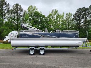 Avalon VLS 2280 QL 2022 Avalon VLS 2280 QL pontoon boat on trailer, parked outdoors.