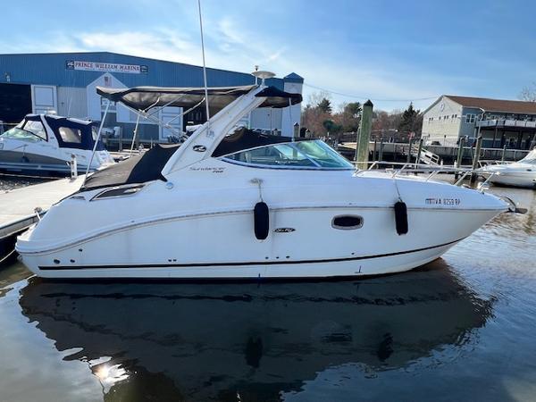 Sea Ray 260 Sundancer 2010 Sea Ray 260 Sundancer docked at a marina.