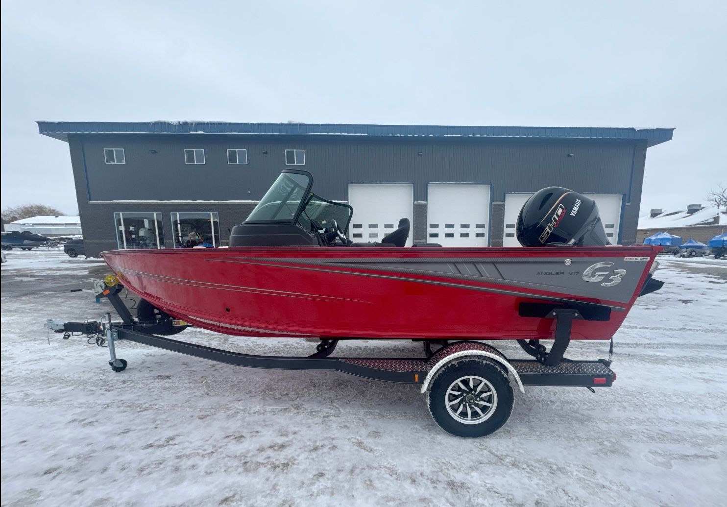 G3 AV 17 FS Red 2026 G3 AV 17 FS boat on trailer in snow.