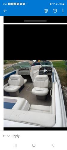 Chaparral 2130 SS 1998 Chaparral 2130 SS boat interior with white seating and steering console.