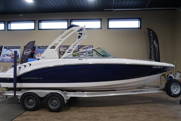Chaparral 23 SSi 2022 Chaparral 23 SSi boat on trailer in showroom.