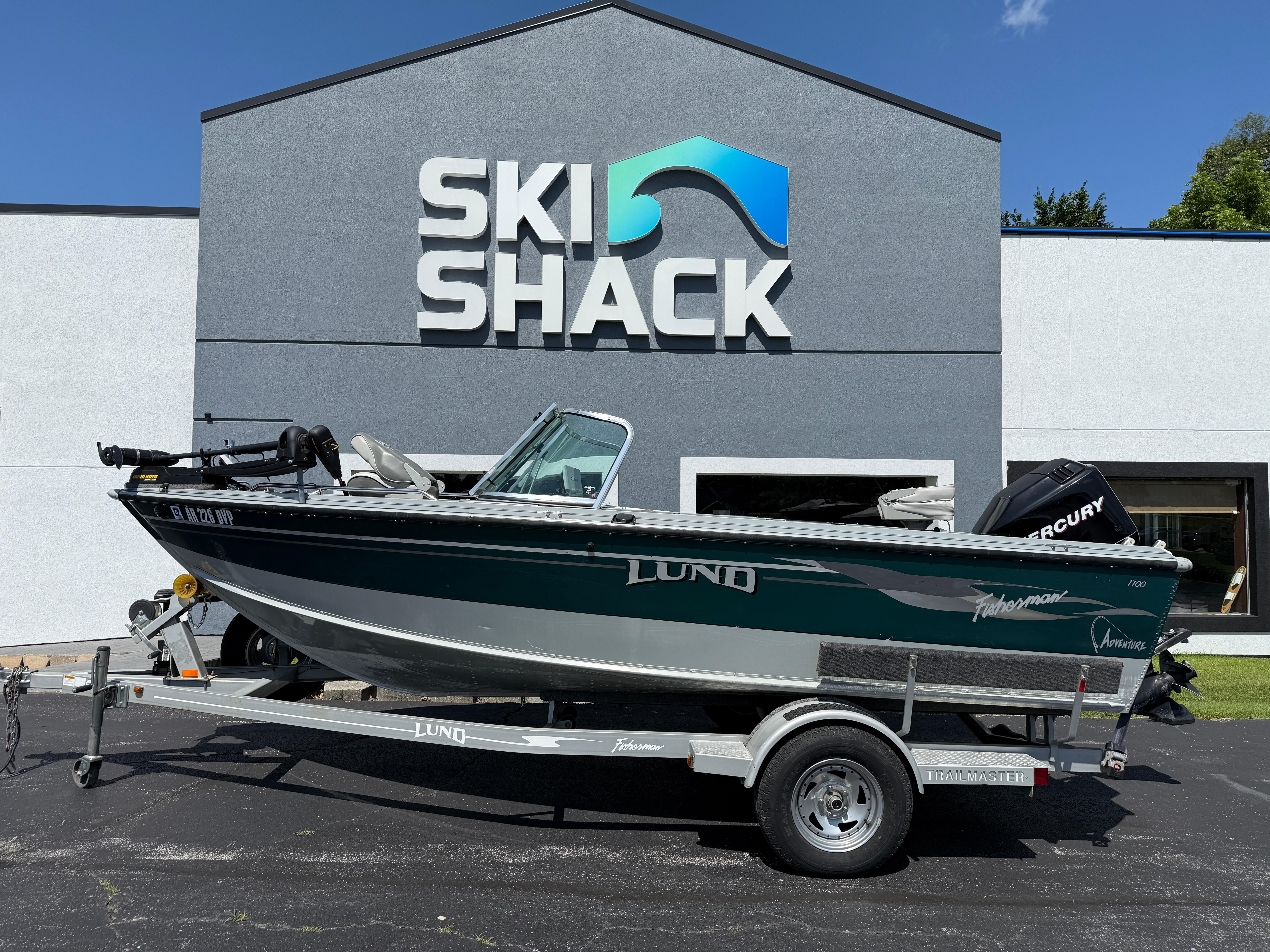 Lund 1700 Fisherman 2005 Lund 1700 Fisherman boat on trailer outside Ski Shack building.