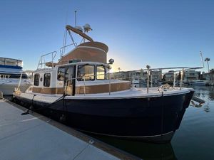 Ranger Tugs R-31 CB 2022 Ranger Tugs R-31 CB docked at marina during sunset.