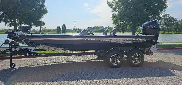 Ranger RT198P 2024 Ranger RT198P fishing boat on trailer by a lake.