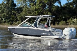 Chaparral 280 OSX 2025 Chaparral 280 OSX boat with Yamaha engines on a calm river.