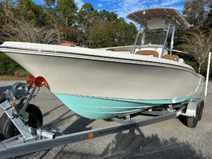 Pioneer 220 Bay Sport 2024 Pioneer 220 Bay Sport boat on a trailer, side view.