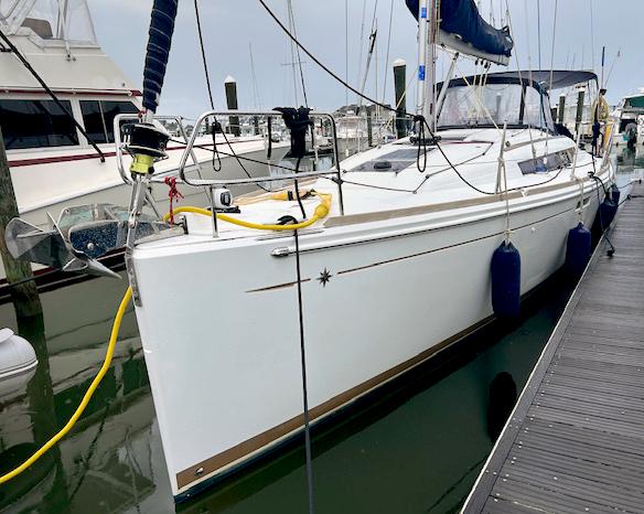 Jeanneau Sun Odyssey 389 2018 Jeanneau Sun Odyssey 389 sailboat docked at marina, side view.