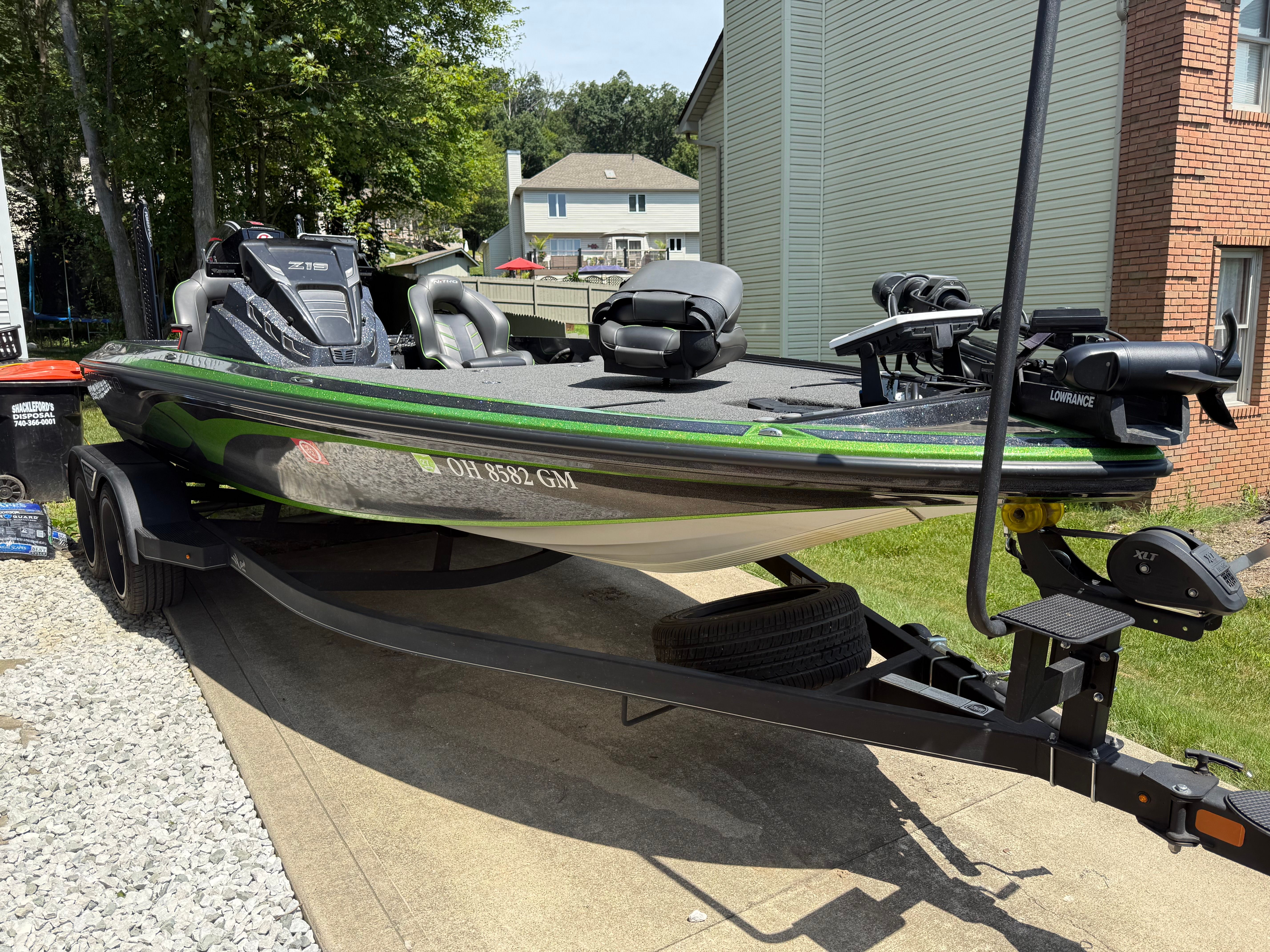 Nitro Z19 Pro 2023 Nitro Z19 Pro boat on trailer, parked in residential driveway.