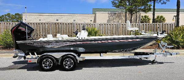 Ranger RB210 2024 Ranger RB210 boat on a trailer, parked outdoors.