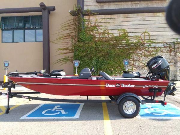 Tracker Bass Tracker Classic XL 2025 Tracker Bass Tracker Classic XL boat parked in a handicap space.