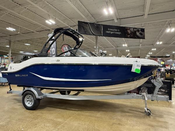 Bayliner D20 2025 Bayliner D20 boat on display in a showroom, featuring sleek blue and white design.