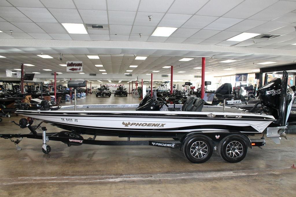 Phoenix 21 XE 2026 Phoenix 21 XE boat displayed in a showroom, featuring sleek design and modern features.