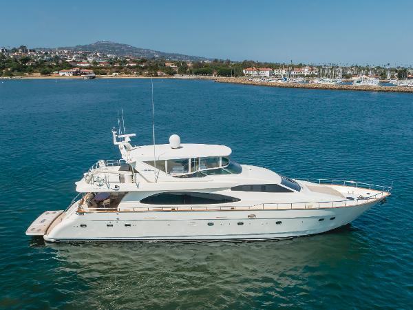 Azimut 85 Ultimate 2005 Azimut 85 Ultimate yacht on serene blue water near coastal town.