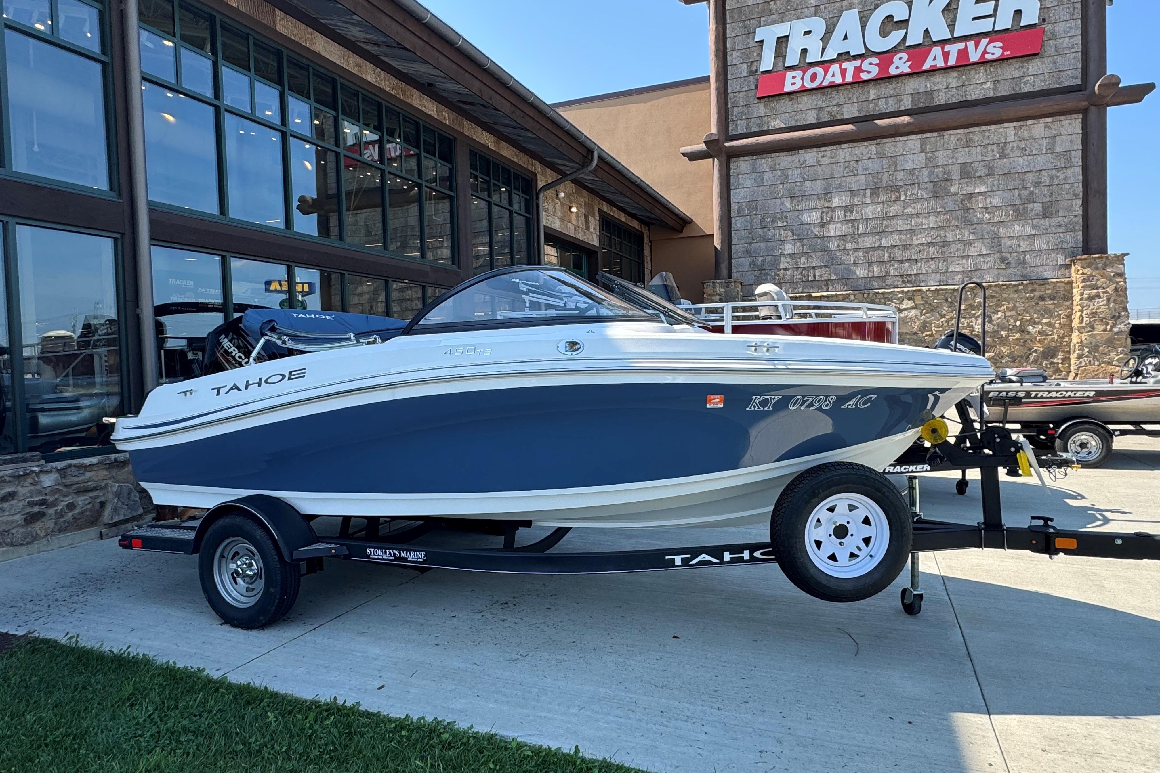 Tahoe 450TS 2018 Tahoe 450TS boat on trailer outside Tracker Boats dealership.