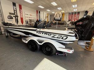 Nitro Z20 XL Pro 2025 Nitro Z20 XL Pro boat in showroom, featuring sleek design and dual-axle trailer.