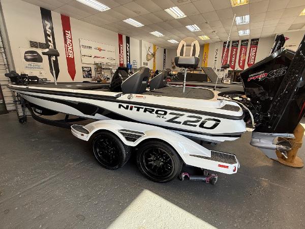 Nitro Z20 XL Pro 2025 Nitro Z20 XL Pro boat in showroom, featuring sleek design and dual-axle trailer.
