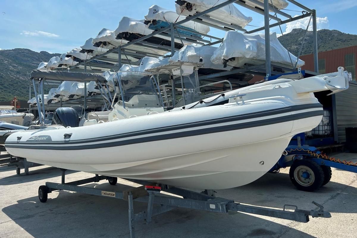 Capelli Tempest 775 2023 Capelli Tempest 775 boat on trailer outdoors.