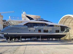 Azimut Grande 27M Azimut Grande 27M 2020 yacht on dry dock under clear blue sky.