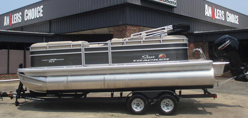 Sun Tracker Party Barge 20 DLX 2025 Sun Tracker PARTY BARGE® 20 DLX pontoon boat on trailer at Anglers Choice dealership.