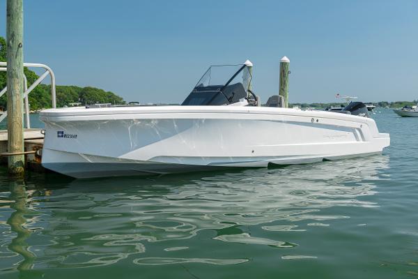 Axopar 22 Spyder 2021 Axopar 22 Spyder boat docked on calm water.