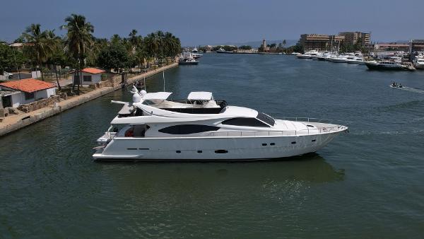 Ferretti Yachts 760 2004 Ferretti Yachts 760 cruising in a scenic coastal waterway.