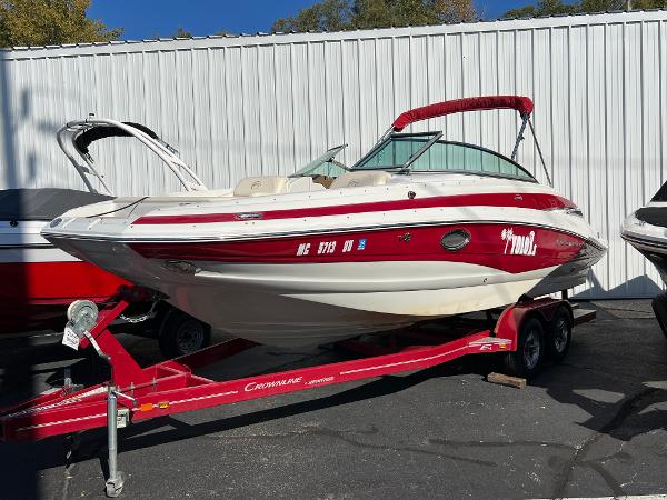 Crownline Q4 2013 Crownline Q4 boat on red trailer, parked outdoors.