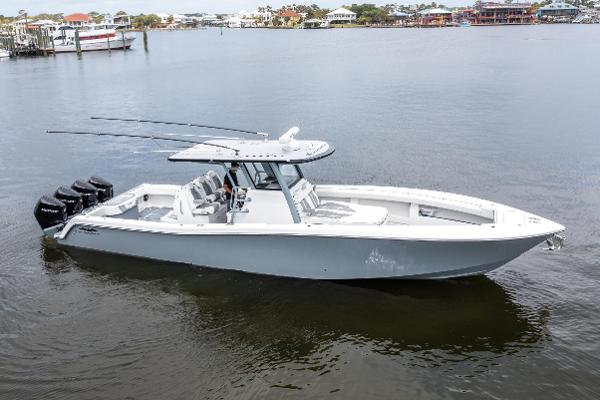 Invincible 39 Open Fisherman 2022 Invincible 39 Open Fisherman boat on calm water, featuring multiple outboard engines.