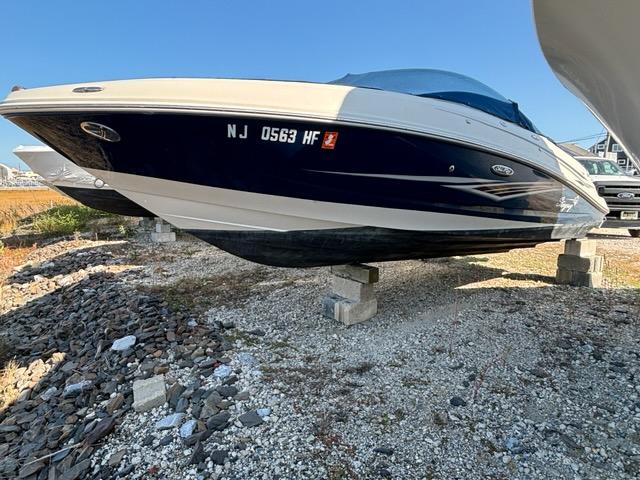 Sea Ray 210 Select 2010 Sea Ray 210 Select boat on dry dock, blue and white exterior.