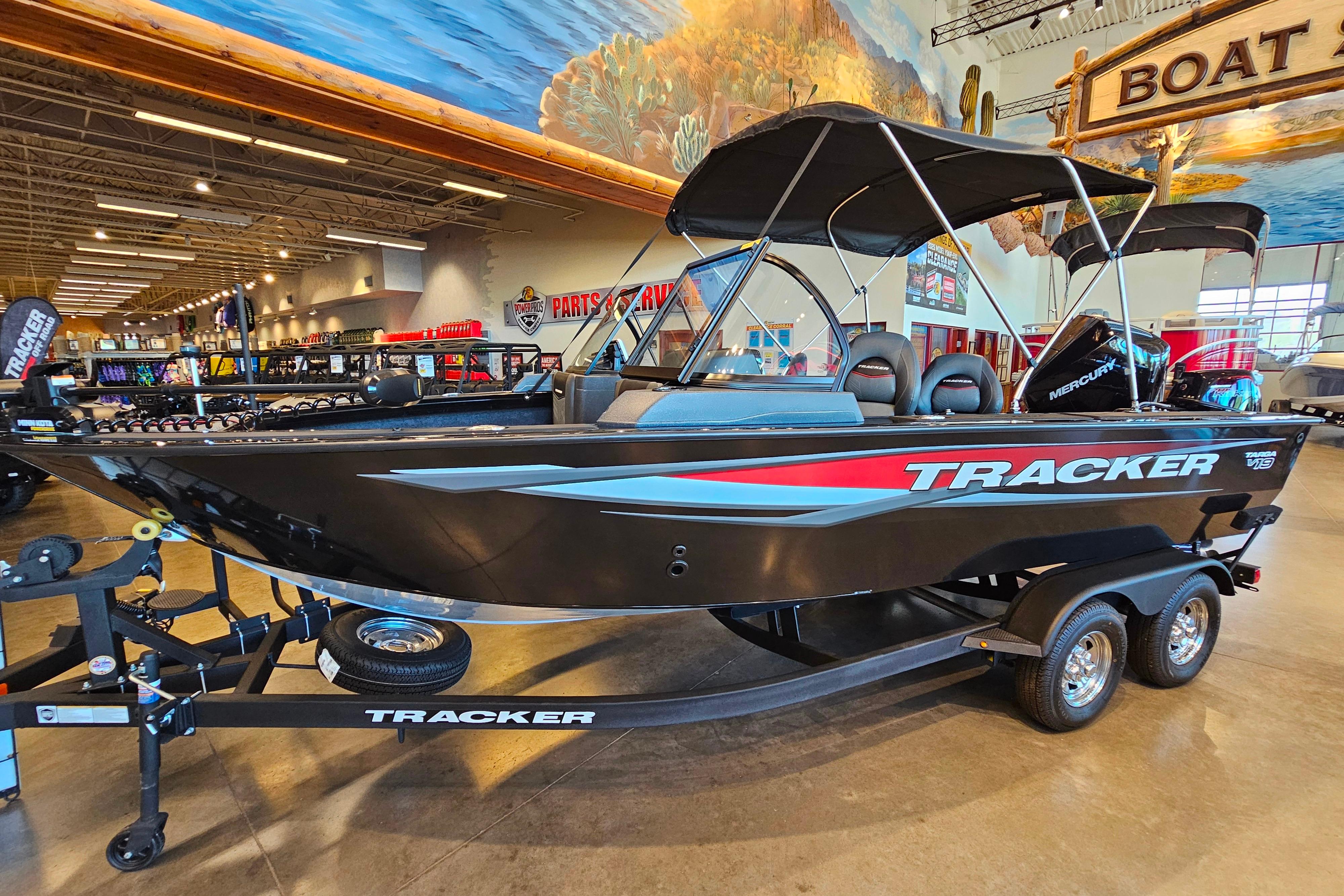 Tracker Targa V-19 WT 2025 Tracker Targa V-19 WT boat displayed indoors with vibrant mural background.