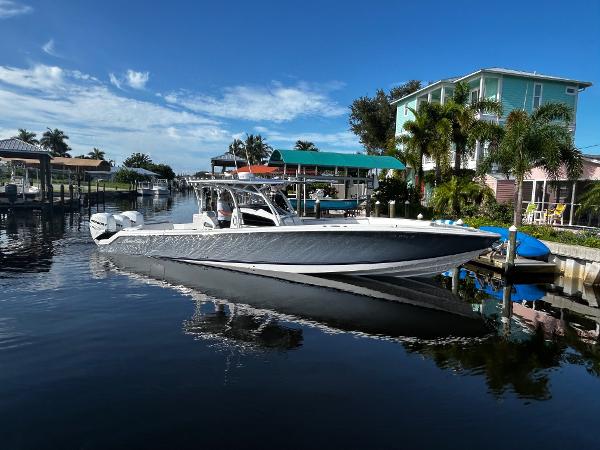 Nor-Tech 390 Sport Center Console 2021 Nor-Tech 390 Sport Center Console boat docked in a scenic waterfront area.