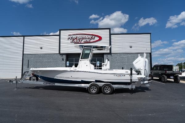 Caymas 26 HB 2025 Caymas 26 HB boat on a trailer outside Performance East Inc. dealership.