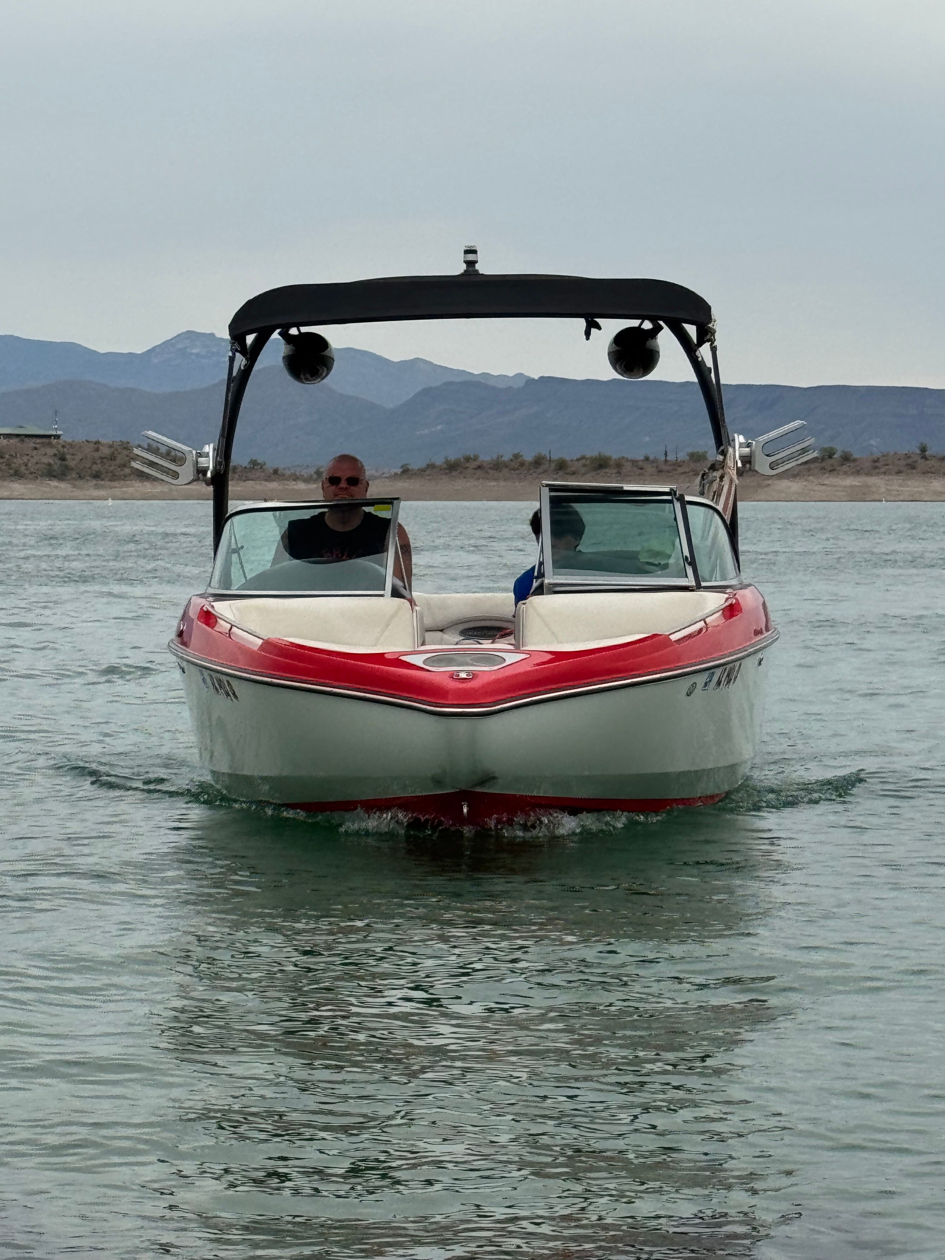 Centurion Enzo SV244 2012 Centurion Enzo SV244 boat on water with mountains in background.
