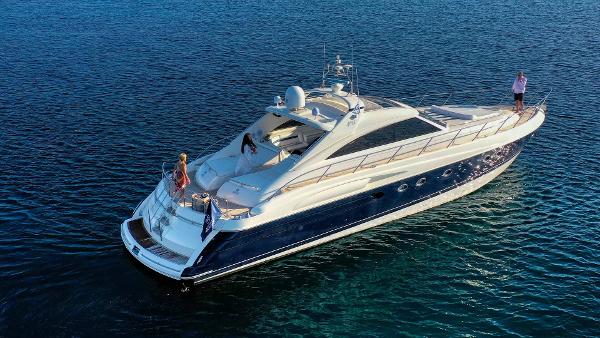 Princess V65 Luxury Princess V65 yacht from 2000 cruising on calm blue waters.