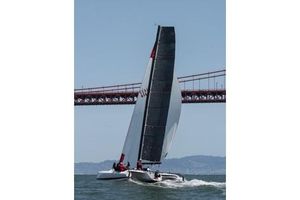 Marstrom Seacart 30 Sailing Marstrom Seacart 30 catamaran under a bridge, 2005 model.