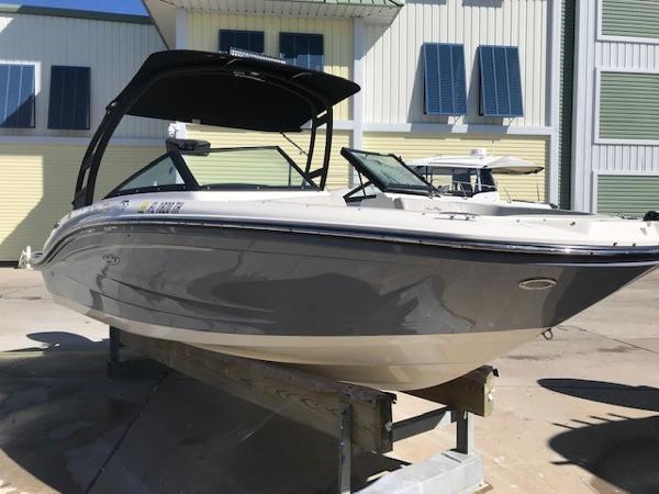 Sea Ray SPX 190 Outboard 2022 Sea Ray SPX 190 OB boat on display in a sunny marina.